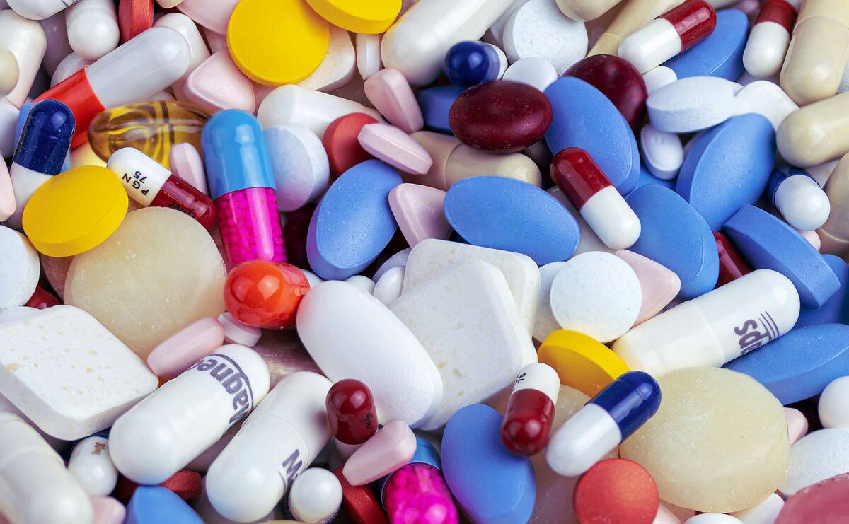 White, blue, and orange medication pills